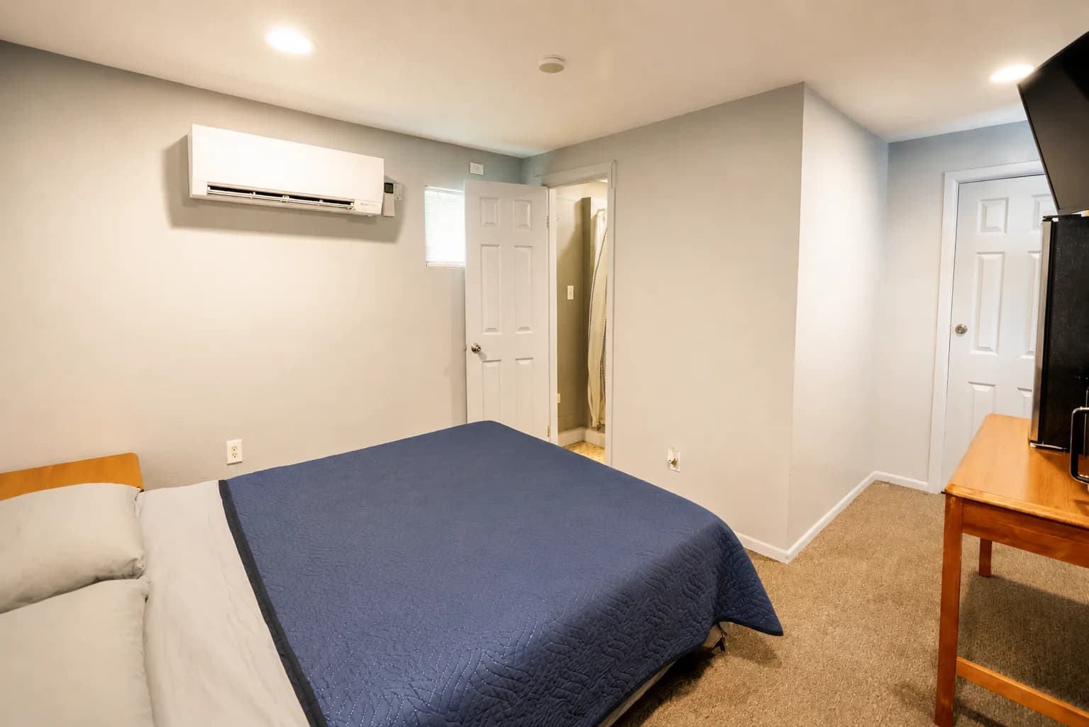 Bright guest room with a queen bed